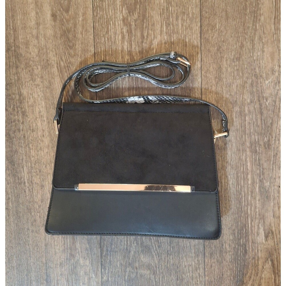 Est. 1946 black and gold purse with a snake  skin strap